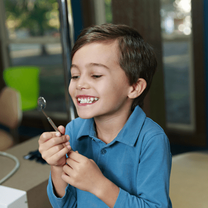 child smiling with braces